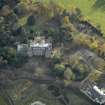 Oblique aerial view centred on the house with the clubhouse adjacent, taken from the NNW.
