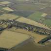 General oblique aerial view centred on the former hospital with East Fortune farmstead adjacent, taken from SE.