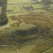 Oblique aerial view centred on the remains of the settlement, taken from the N.