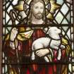 Interior. N side stained glass window. Detail of The Good Shepherd