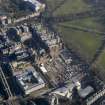Oblique aerial view centred on the former Royal Infirmary buildings (now Quartermile), taken from the SE.