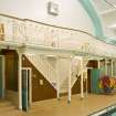 Interior view of pool area showing stair and spectators gallery, Victoria Public Baths, Leith, Edinburgh.
