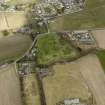 General oblique aerial view centred on the orchard and the remains of the rig with the smallholding, cottages and poultry houses adjacent, from the SSE.