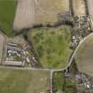 General oblique aerial view centred on the orchard and the remains of the rig with the smallholding, cottages and poultry houses adjacent, from the NNW.