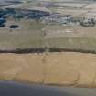 Oblique aerial view centred on the reed beds with the village adjacent, taken from the SE.