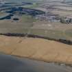 Oblique aerial view centred on the reed beds with the village adjacent, taken from the ESE.