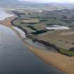 General oblique aerial view looking along the coast and centred on the reed beds, taken from the E.