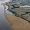 General oblique aerial view looking along the coast but centred on the reed beds, taken from the ENE.