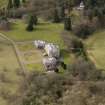 Oblique aerial view centred on the House with the coach house and stables adjacent, taken from the ESE.