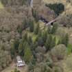 Oblique aerial view centred on the coach house and stables with the Avenue Bridge adjacent, taken from the SE.