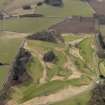 Oblique aerial view centred on the golf course with the dovecot and lodge adjacent, taken from the ENE.