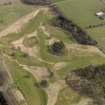 Oblique aerial view centred on the golf course with the dovecot adjacent, taken from the W.