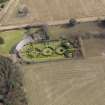 Oblique aerial view centred on the walled garden and estate cottage, taken from the W.