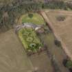 Oblique aerial view centred on the walled garden and estate cottage, taken from the SSW.
