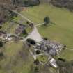 Oblique aerial view centred on the house with the walled garden adjacent, taken from the NW.