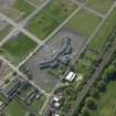 Oblique aerial view centred on Craigmiller Primary School, taken from the NE.