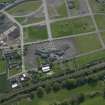 Oblique aerial view centred on Craigmiller Primary School, taken from the NNE.