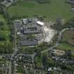 Oblique aerial view centred on the school, taken from the NW.