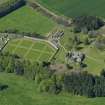Oblique aerial view centred on the walled garden with the stable block adjacent, taken from the SE.