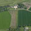 General oblique aerial view centred on the country house with the W approach adjacent, taken from the WSW.