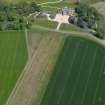 General oblique aerial view centred on the country house with the W approach adjacent, taken from the  SW.