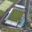 Oblique aerial view centred on the football ground, taken from the SSE.
