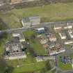 Oblique aerial view centred on Nairn's south factory with the office block adjacent, taken from the S.