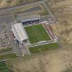 Oblique aerial view centred on the football ground, taken from the S.