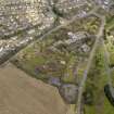 Oblique aerial view centred on the Distillers Head Office with the gardens adjacent, taken from the SW.