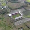 Oblique aerial view centred on the football ground, taken from the WNW.