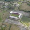 Oblique aerial view centred on the football ground, taken from the SW.