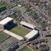 Oblique aerial view centred on the football ground, taken from the NE.