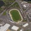 Oblique aerial view centred on the greyhound stadium, taken from the S.