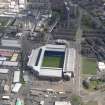 Oblique aerial view centred on the football ground, taken from the W.