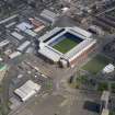 Oblique aerial view centred on the football ground, taken from the SW.