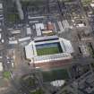 Oblique aerial view centred on the football ground, taken from the SSW.