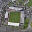Oblique aerial view centred on St Mirren football stadium, Paisley, taken from the E.
