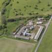 Oblique aerial view centred on the poultry farm with the airfield dispersed site adjacent, taken from the NE.