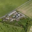 Oblique aerial view centred on the poultry farm with the airfield dispersed site adjacent, taken from the SW.