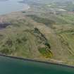 General oblique aerial view centred on the firing ranges with the golf course adjacent, taken from the E.