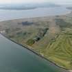 General oblique aerial view centred on the Links with the firing range and golf course adjacent, taken from the ENE.