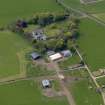 Oblique aerial view centred on the aircraft hangars with Hatton House adjacent, taken from the NE.