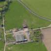 Oblique aerial view centred on the aircraft hangars with Hatton House adjacent, taken from the NE.