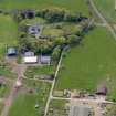 Oblique aerial view centred on the aircraft hangars with Hatton House adjacent, taken from the NNE.