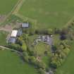 Oblique aerial view centred on the aircraft hangars with Hatton House adjacent, taken from the NW.