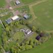 Oblique aerial view centred on the aircraft hangars with Hatton House adjacent, taken from the WSW.