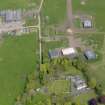 Oblique aerial view centred on the aircraft hangars with Hatton House adjacent, taken from the SW.