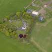 Oblique aerial view centred on the aircraft hangars with Hatton House adjacent, taken from the S.