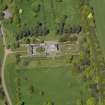 Oblique aerial view centred on the house with the gardens adjacent, taken from the S.