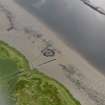Oblique aerial view centred on the remains of Dumbuck crannog (NS47SW 8), taken from the NW.